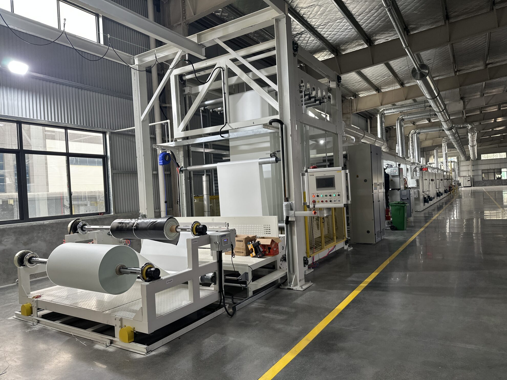 Large coating machine used for manufacturing welding enclosure panels