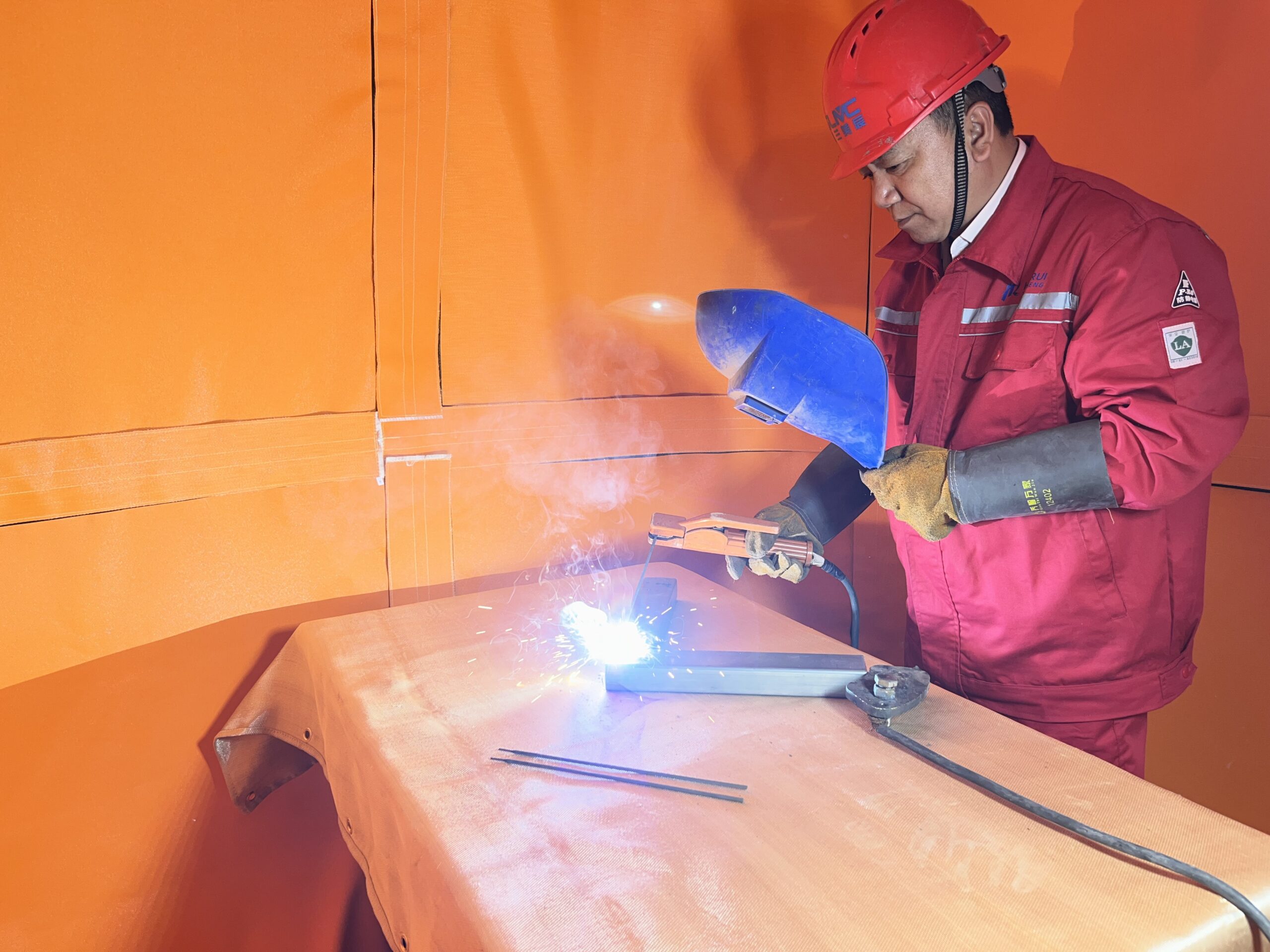 a worker is welding in the welding habitat system