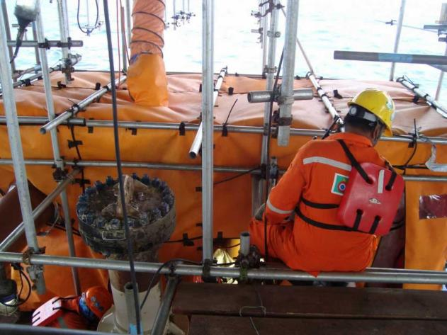 Workers are maintaining the welding habitat system