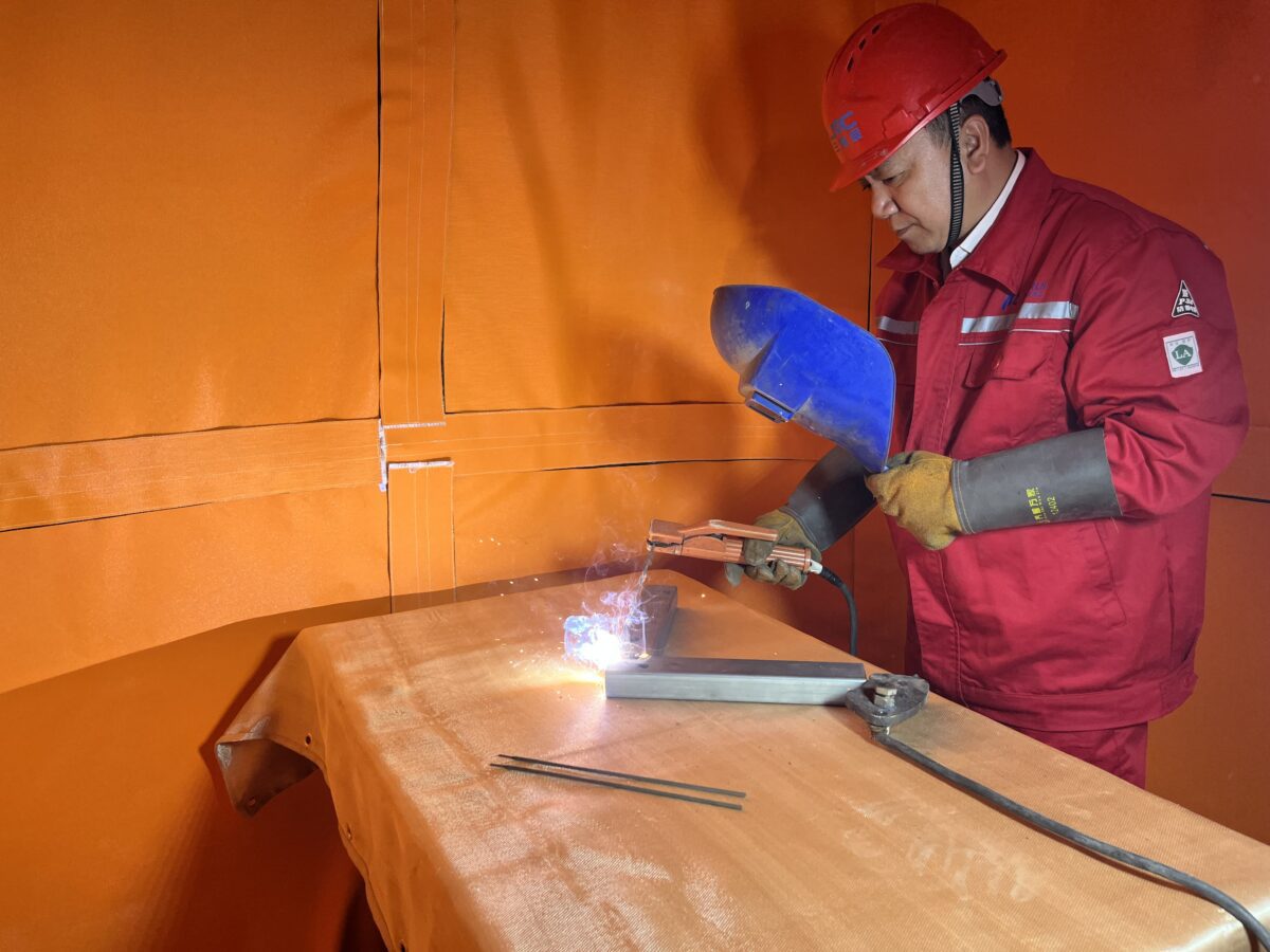 Workers are welding in the welding habitat